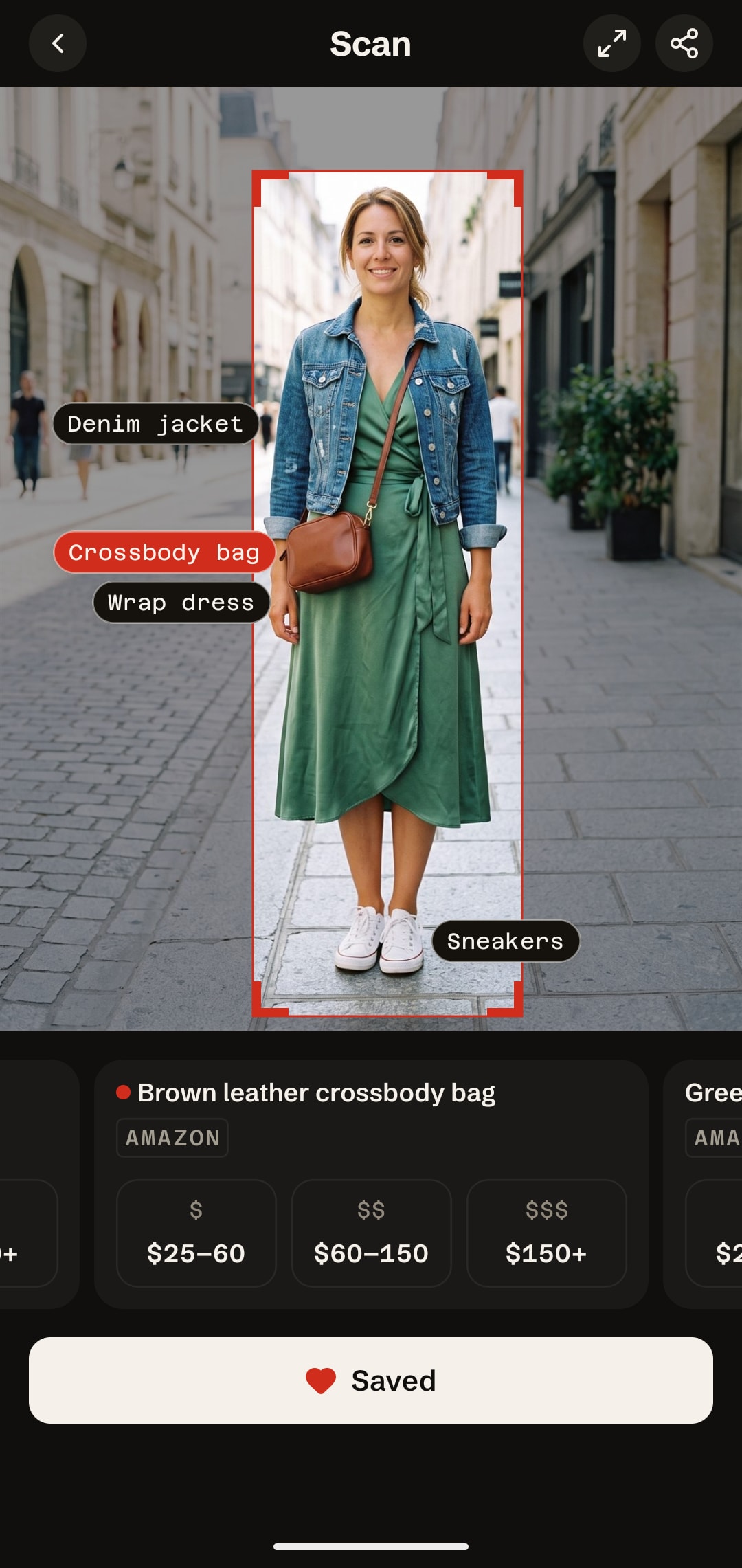 IDtheLook scan of a woman in a denim jacket and green wrap dress in dark mode, with a filled Saved button